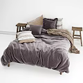 Double Bed In Cozy Bedroom With Soft Gray Bedding Multiple Pillows And Wooden Nightstands