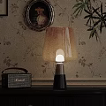 Vintage Table Lamp With Soft Light Lampshade On Table Near Retro Radio And Floral Wallpaper