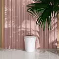 Modern White Toilet Design In Bathroom With Pink Curtain And Green Plant Decor