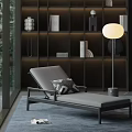 Modern Gray Lounge Chair With Geometric Cushion And Round Floor Lamp By Dark Bookshelf