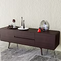 Dark Wooden TV Stand With Drawers And Decorative Ornaments On Marble Floor And Light Wall