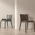 Modern Minimalist Leather Dining Chairs in Gray and Brown with Light Wall and Wooden Floor