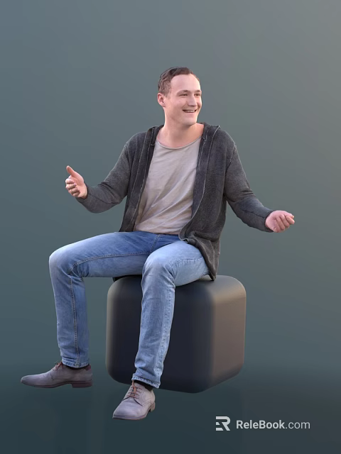 Smiling Man Sitting On Black Cube Wearing Gray Cardigan And Blue Jeans 3d model 