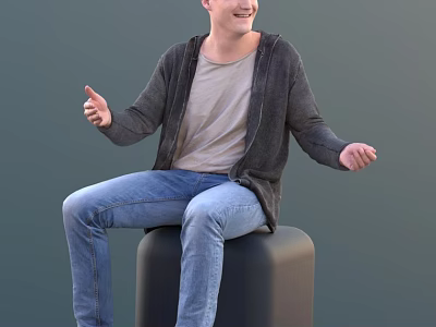 Smiling Man Sitting On Black Cube Wearing Gray Cardigan And Blue Jeans 3d model