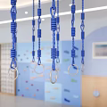 Modern Kindergarten Interior With Climbing Wall Blue Chandeliers And Colorful Floors