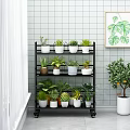 Elegant Garden Decor With Black Multi Tiered Plant Shelf Potted Plants And Green Plant Painting