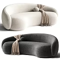 Light Beige and Dark Gray Curved Sectional Sofa with Round Pillow and Fringed Blanket