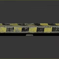 Worn Concrete Road Barrier Block With Yellow And Black Stripes And Scratches