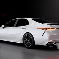 Sleek White Modern Sedan With Black Wheels And Red Interior Seats
