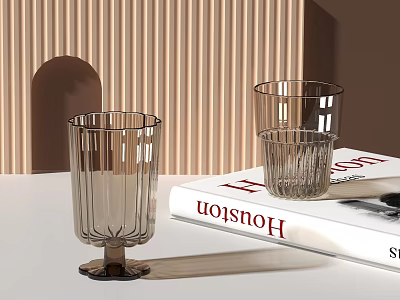 Transparent Vertical Striped Glass Cups On White Table Next To Red Houston Book 3d model