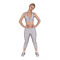 Fit Woman In White Activewear Standing With Hands On Hips Against Black Gear Background