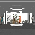Modern Clothing Store Interior Featuring Women's Dresses Racks Mannequins Bright Lighting And Sofa