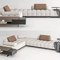Modern Beige Sectional Sofa With Brown Cushions Coffee Table And Throw Blanket 3d model