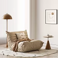 Cozy Beige Quilted Lazy Sofa in Minimalist Living Room with Side Table and Floor Lamp
