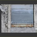 Rustic Furniture Cabinet With Stone Sides And Blue Metal Roller Shutter