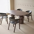 Modern Oval Wooden Dining Table with Four Black Chairs and Round Bases in Minimalist Interior