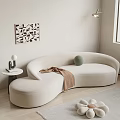 Cozy Modern Interior Design With Beige Curved Irregular Shaped Sofa And Side Table Wall Art