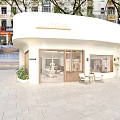 Modern Minimalist Wood Accent Clothing Store Interior With Comfortable Lounge Area And Garment Display Racks