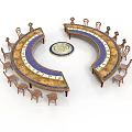 Curved Tables With Wooden Finish And Chairs Arranged Around Decorative Circular Centerpiece
