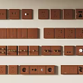 Brown Switch Panels with Various Designs and Sockets Arranged on Wall 3d model