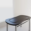 Modern Dining Table With Black Curved Tabletop And Sleek Metal Legs