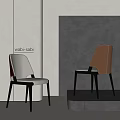 Wabi Sabi Style Dining Chairs With Cream And Brown Upholstery And Black Slim Legs