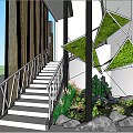 Contemporary Indoor Landscape Featuring Staircase Railing Green Plants Geometric Structures And Rock Decor