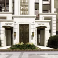 Elegant Modern Residential Building Exterior With Balconies Large Windows And Green Landscaping