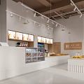 Modern Bright Dessert Shop Interior With Product Displays And Counters