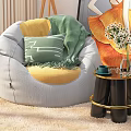 Stylish Gray Bean Bag Chair With Yellow Cushion Green Blanket And Side Table Flowers