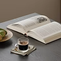 Open Book On Table With Plate Of Fresh Mangoes And Coffee Cup