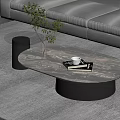 Oval Marble Pattern Coffee Table With Books White Cup And Glass Vase Near Gray Sofa