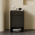 Black Storage Cabinet With Table Lamp Camera Clock On Top And Robot Vacuum Below
