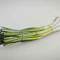 Fresh Green Onions Bunch With Vibrant Green And White Stalks On White Background