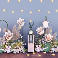 Floral Display With White Flowers Star String Lights Rabbit Figurine And Greenery On Wall Background