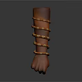 Human Hand Fist Wearing Multiple Golden And Brown Bracelets On Dark Background