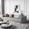 Gray Large Sofa With Gold Trim And Decorative Pillows In Elegant Living Room