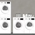 Modern White Washing Machines Stacked And Side By Side With Laundry Detergents And Basket
