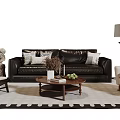 Elegant Leather Sofa With Wooden Coffee Table And Decorative Pillows On Patterned Area Rug