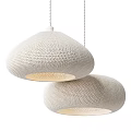 Two Beige Knitted Dome Pendant Lights With Warm Glow For Modern Interior Spaces