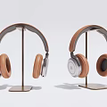 Sleek Modern Headphones with Brown Leather Cups and Silver Metal Stands