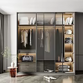 Sleek Modern Wardrobe Interior With Sliding Glass Doors Hanging Garments Folded Clothes And Storage Bags