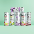 AVE Sparkling Drinks With Various Fruit Flavors In Colorful Cans On Green Background