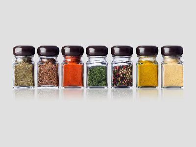 Transparent Glass Spice Jars With Dark Lids And Various Colored Spices 3d model
