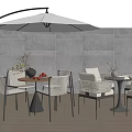 Outdoor Patio Table With Wicker Chairs White Arc Umbrella Gray Tile Wall And Wooden Floor