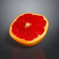 Sliced Grapefruit With Vibrant Red Flesh And Yellow Peel On Dark Background