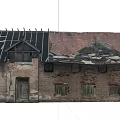 Dilapidated Abandoned Brick House With Partially Damaged Roof Black Red Tiles And Old Windows