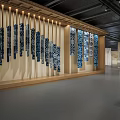 Modern Exhibition Hall Interior With Wooden Decor Blue White Patterned Walls Display Shelves And Chairs