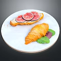 Fresh Fig Toast and Buttery Croissant on White Marble Plate with Green Leaves