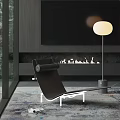 Modern Black Chaise Lounge In Contemporary Living Room With Fireplace Floor Lamp And Area Rug